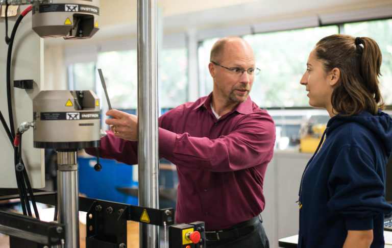 Dean Werner in Haeberle Lab with a student 768x486