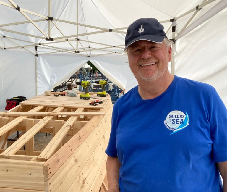 Doug installing the Bottom planks 768x649