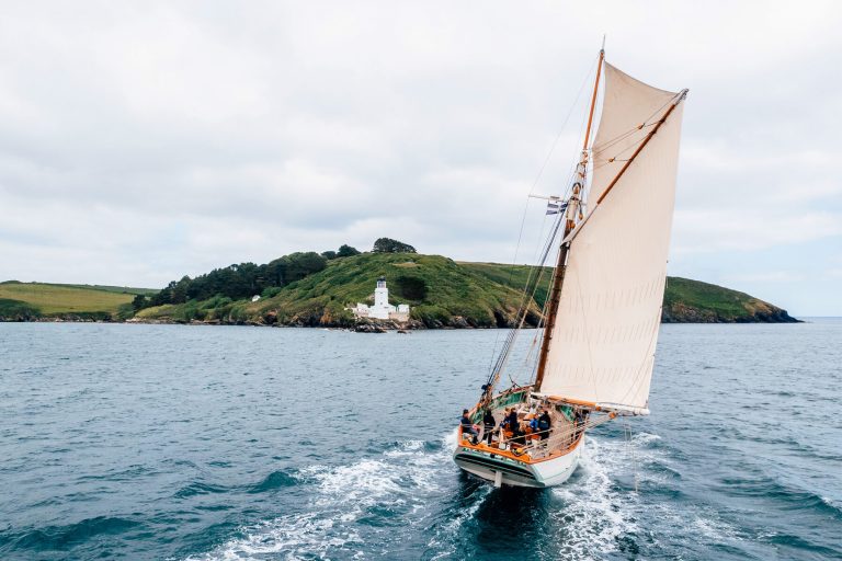 Pellew pilot cutter from stern sailing in Cornwall 1800x1200 1 768x512